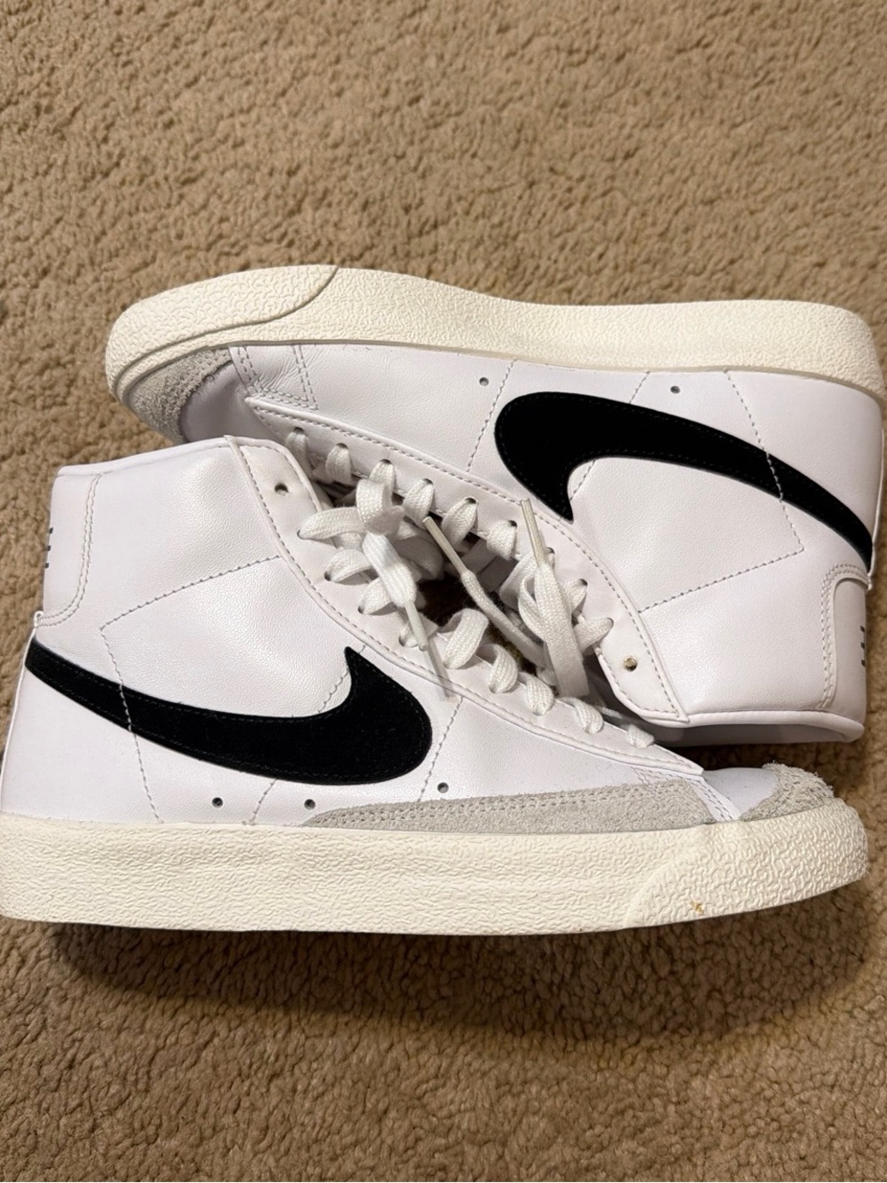 Nike White High-Top Sneakers with Black Swoosh